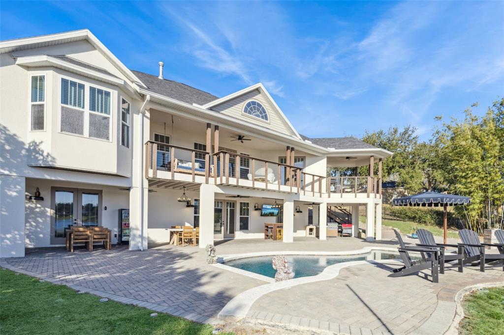 9126 Lake Coventry Court Gotha, FL 34734 - Photo 64 of 75 a front view of a building with sitting area