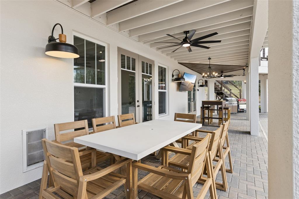 9126 Lake Coventry Court Gotha, FL 34734 - Photo 78 of 99 a view of a dining room with furniture and a chandelier