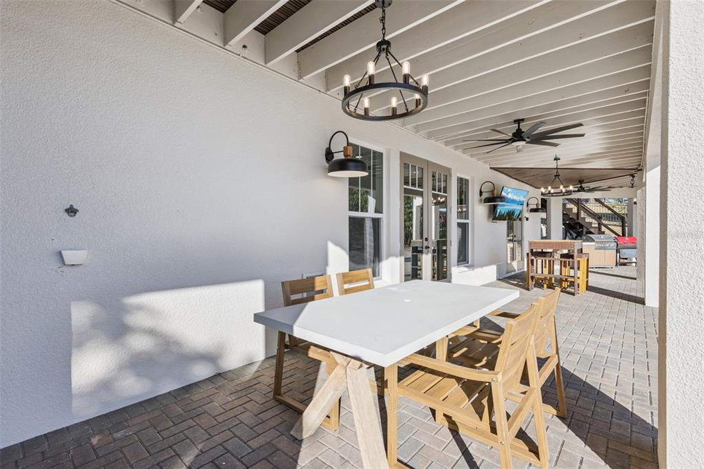 9126 Lake Coventry Court Gotha, FL 34734 - Photo 79 of 99 a view of a dining room with furniture and a chandelier