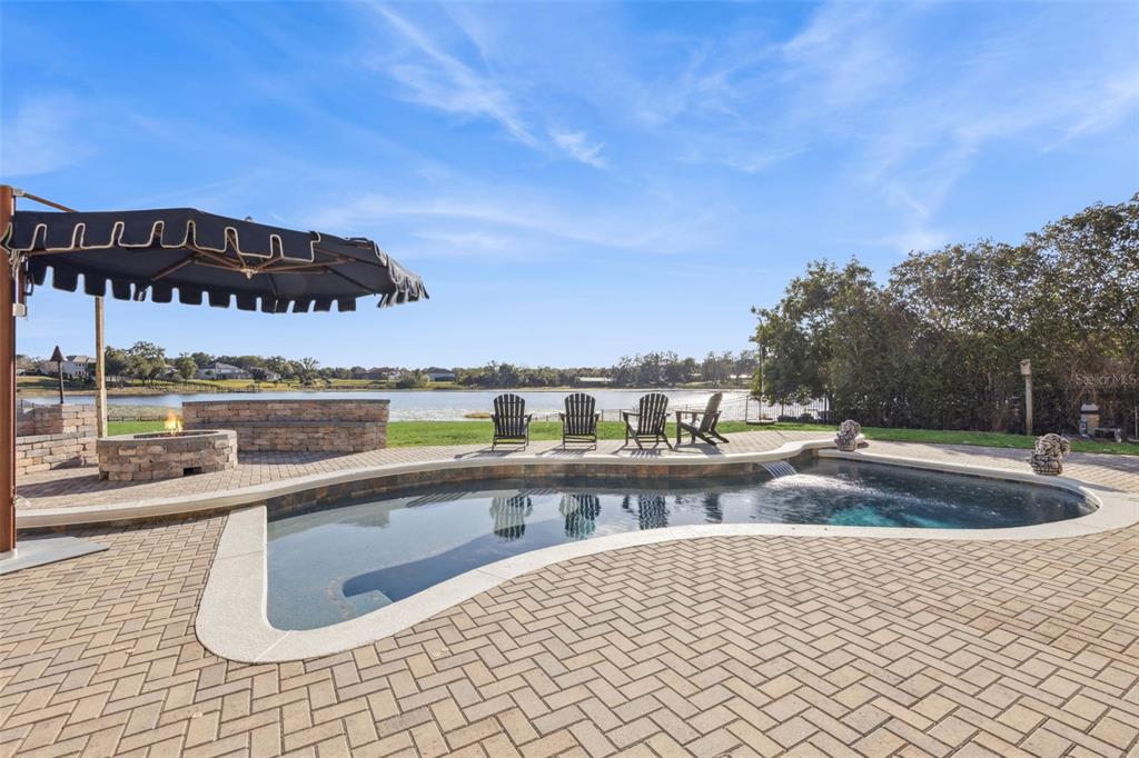 9126 Lake Coventry Court Gotha, FL 34734 - Photo 85 of 99 a view of a swimming pool with a patio