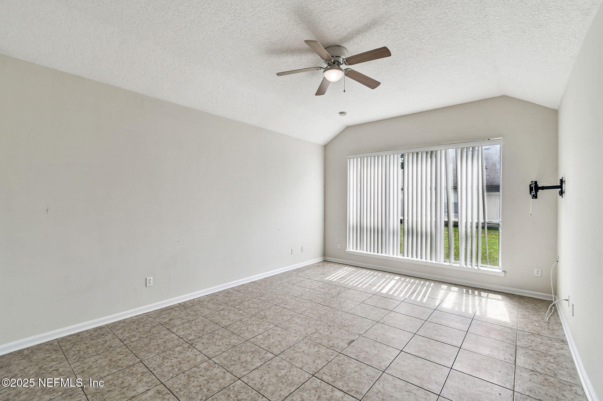 536 Spanish Wells Road Jacksonville, FL 32218 - Photo 15 of 45 a view of an empty room with a window