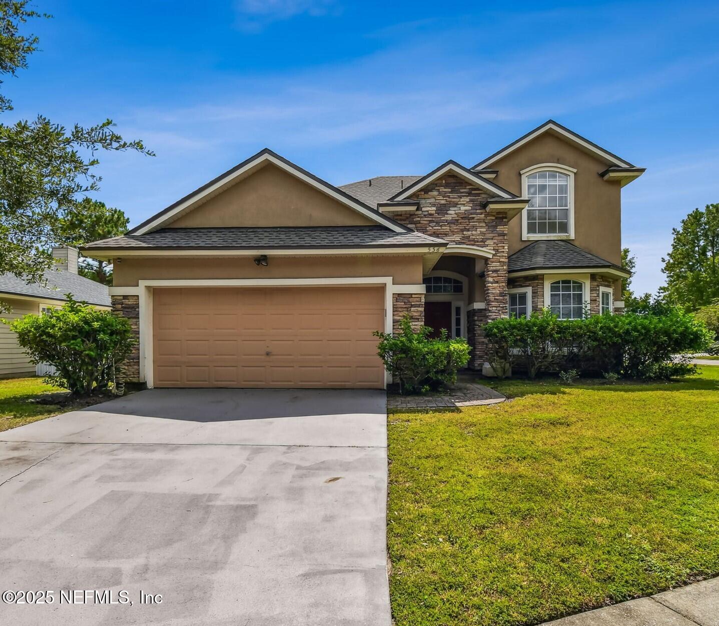 536 Spanish Wells Road Jacksonville, FL 32218 - Photo 2 of 45 a front view of a house with yard