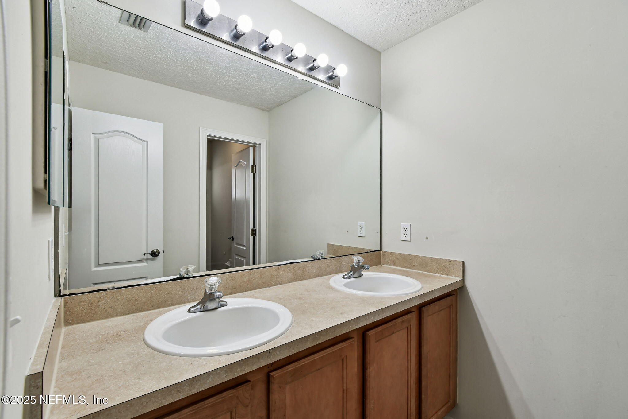 536 Spanish Wells Road Jacksonville, FL 32218 - Photo 25 of 45 a bathroom with a sink and a mirror