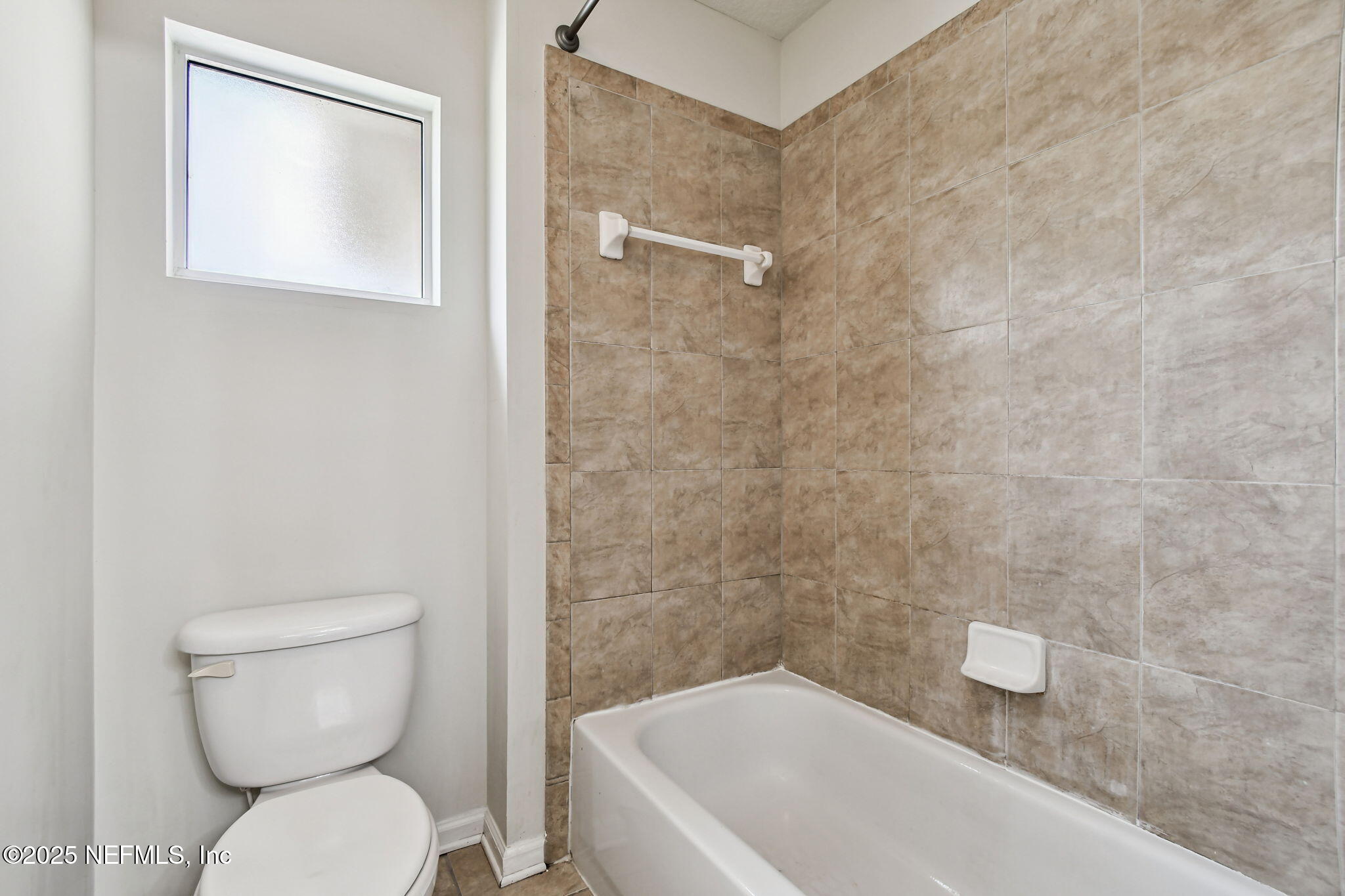 536 Spanish Wells Road Jacksonville, FL 32218 - Photo 26 of 45 a bathroom with a toilet and a bathtub