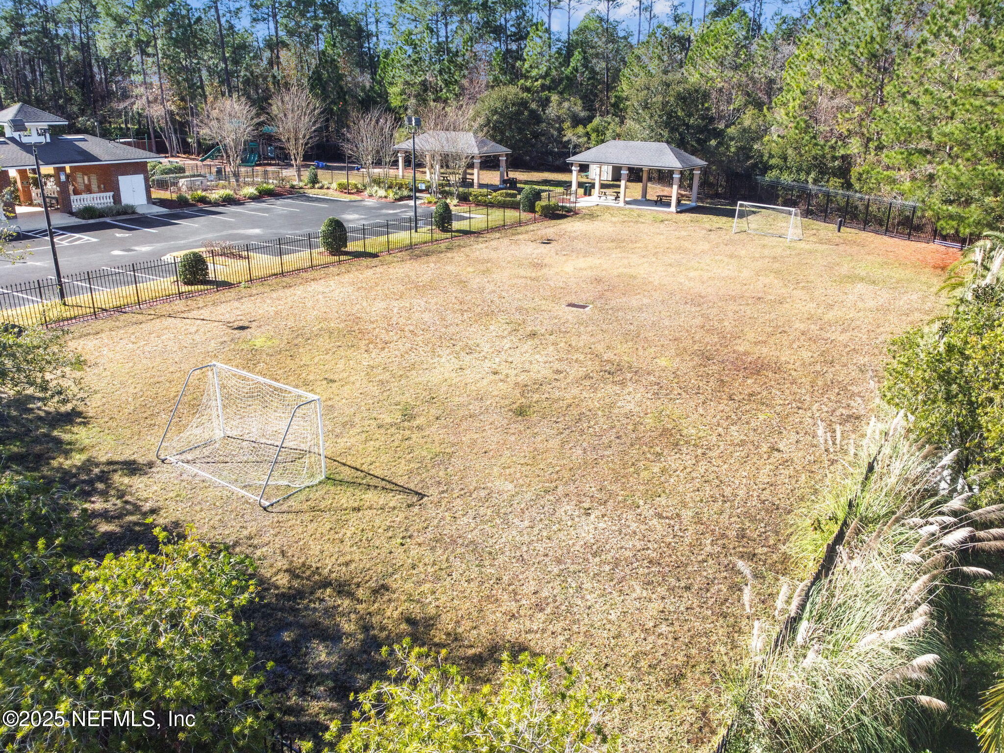 536 Spanish Wells Road Jacksonville, FL 32218 - Photo 44 of 45 a swimming pool with outdoor seating and yard