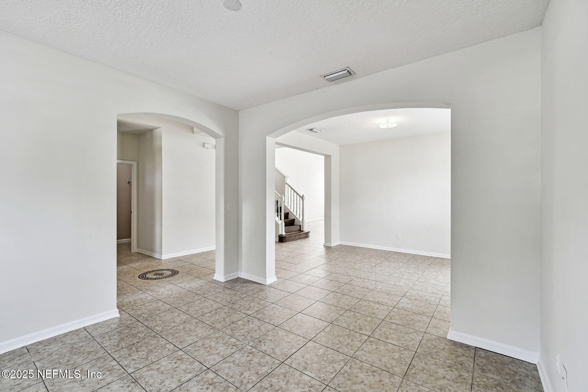 536 Spanish Wells Road Jacksonville, FL 32218 - Photo 6 of 45 a view of a livingroom with wooden floor and a bathroom