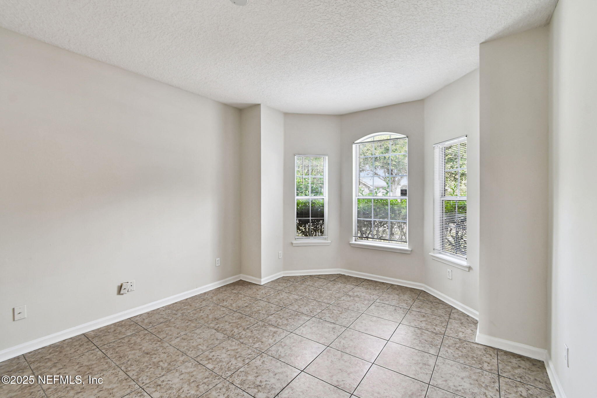 536 Spanish Wells Road Jacksonville, FL 32218 - Photo 7 of 45 a view of an empty room with a window