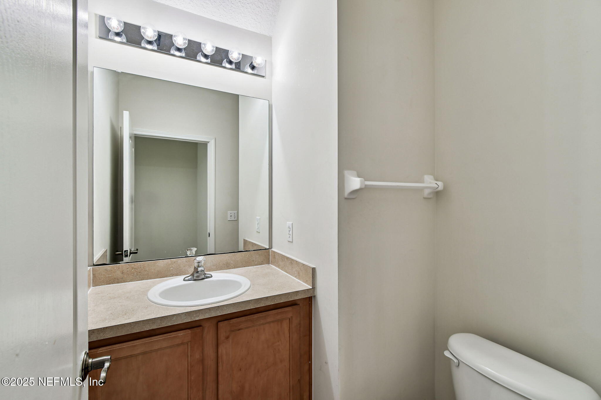 536 Spanish Wells Road Jacksonville, FL 32218 - Photo 9 of 45 a bathroom with a sink and a mirror