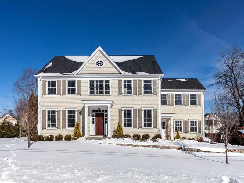 a front view of a residential houses with street