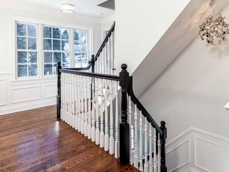 1 Laforge Road Darien, CT 06820 - Photo 12 of 24 a view of staircase with wooden floor and white walls