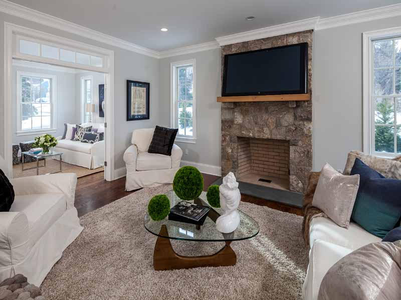 1 Laforge Road Darien, CT 06820 - Photo 4 of 24 a living room with furniture a fireplace and a flat screen tv