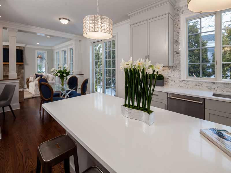 1 Laforge Road Darien, CT 06820 - Photo 6 of 24 a kitchen with stainless steel appliances a dining table wooden floor and a large window