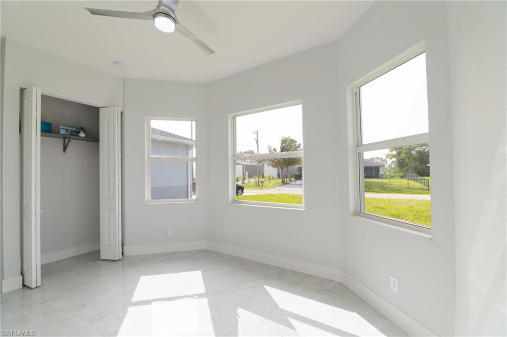 3408 12th Street Southwest Lehigh Acres, FL 33976 - Photo 27 of 47 a view of an empty room with a window