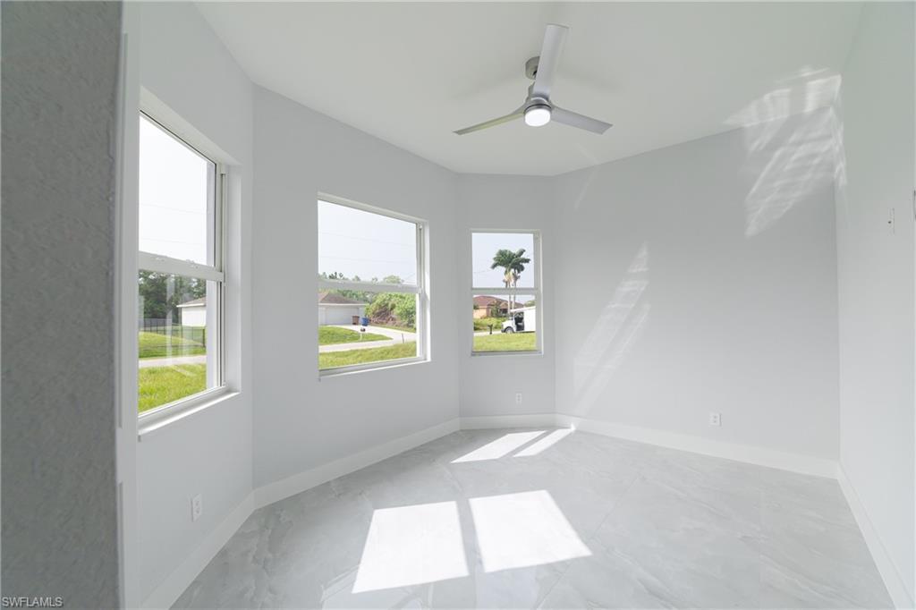 3408 12th Street Southwest Lehigh Acres, FL 33976 - Photo 28 of 47 a view of an empty room and window