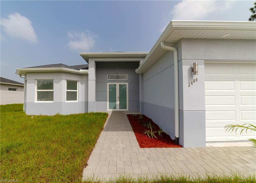 3408 12th Street Southwest Lehigh Acres, FL 33976 - Photo 37 of 47 a view of outdoor space yard and front view of a house