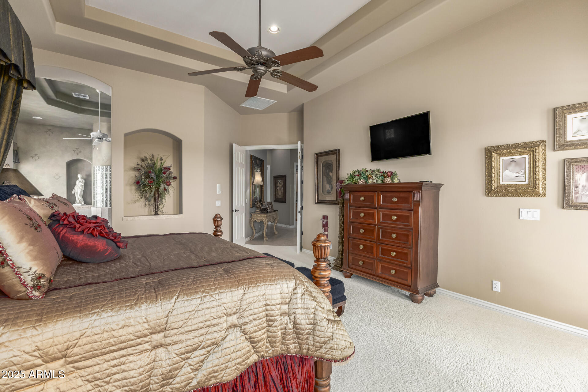 4055 North Recker Road Mesa, AZ 85215 - Photo 20 of 70 a bedroom with a bed and a flat screen tv