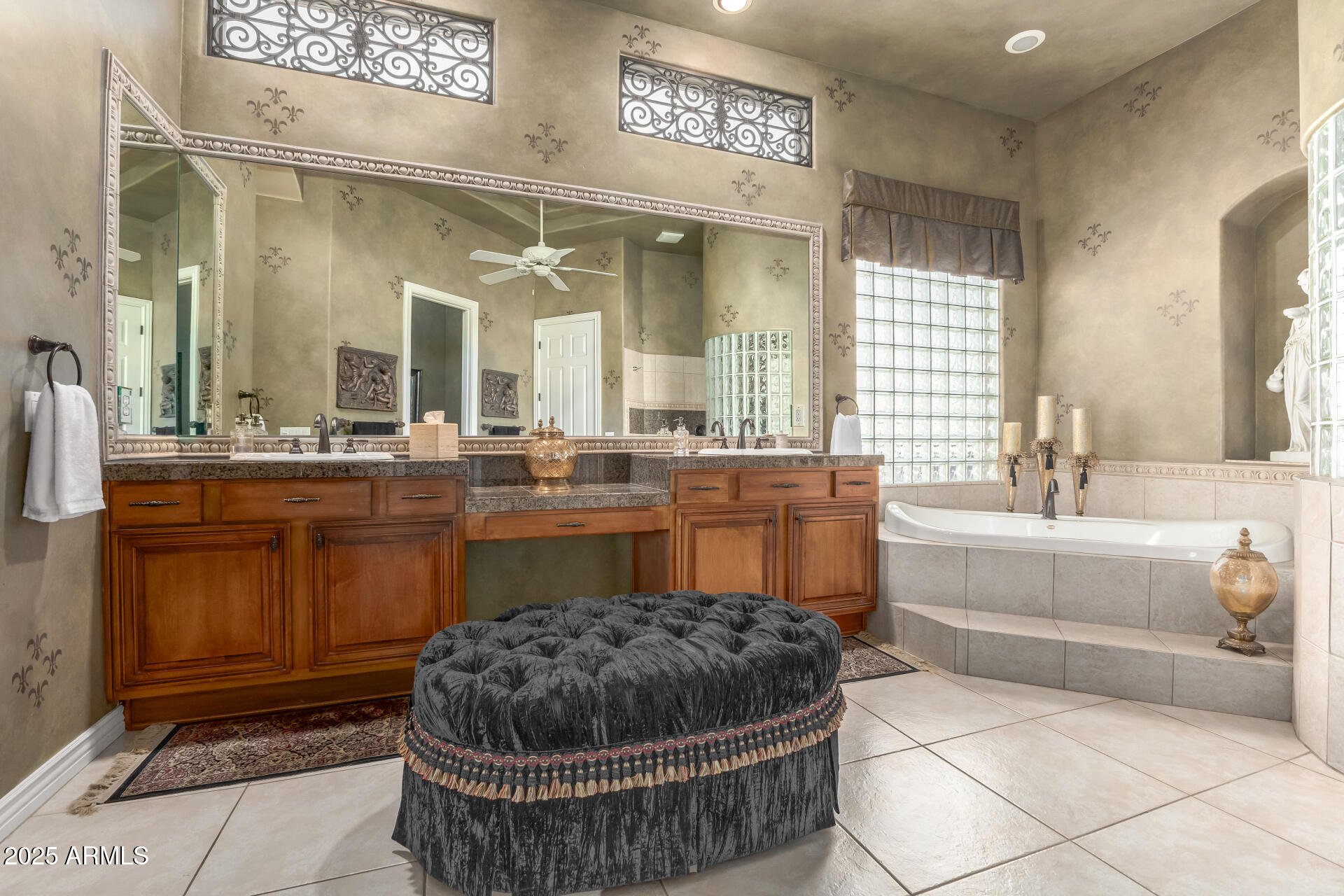 4055 North Recker Road Mesa, AZ 85215 - Photo 21 of 70 a bathroom with a tub a sink and mirror