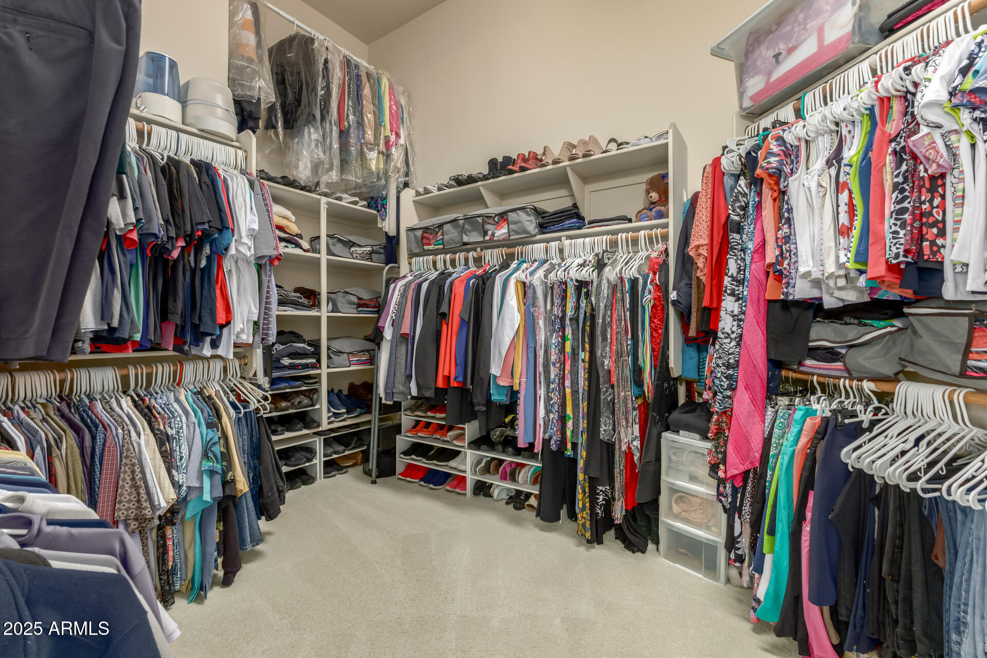 4055 North Recker Road Mesa, AZ 85215 - Photo 24 of 70 a view of walk in closet with clothes