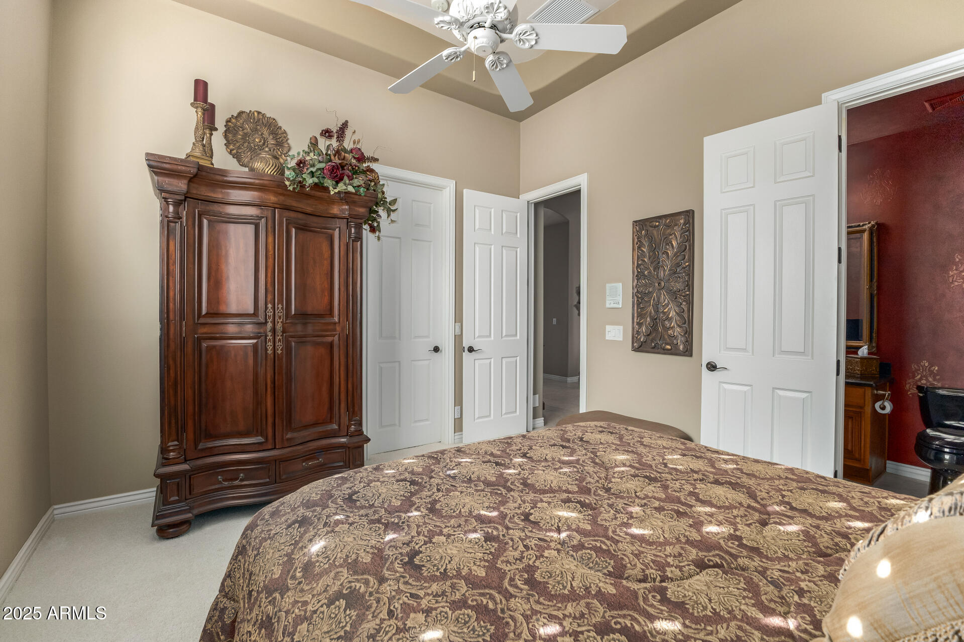 4055 North Recker Road Mesa, AZ 85215 - Photo 27 of 70 a bedroom with a bed and a dresser