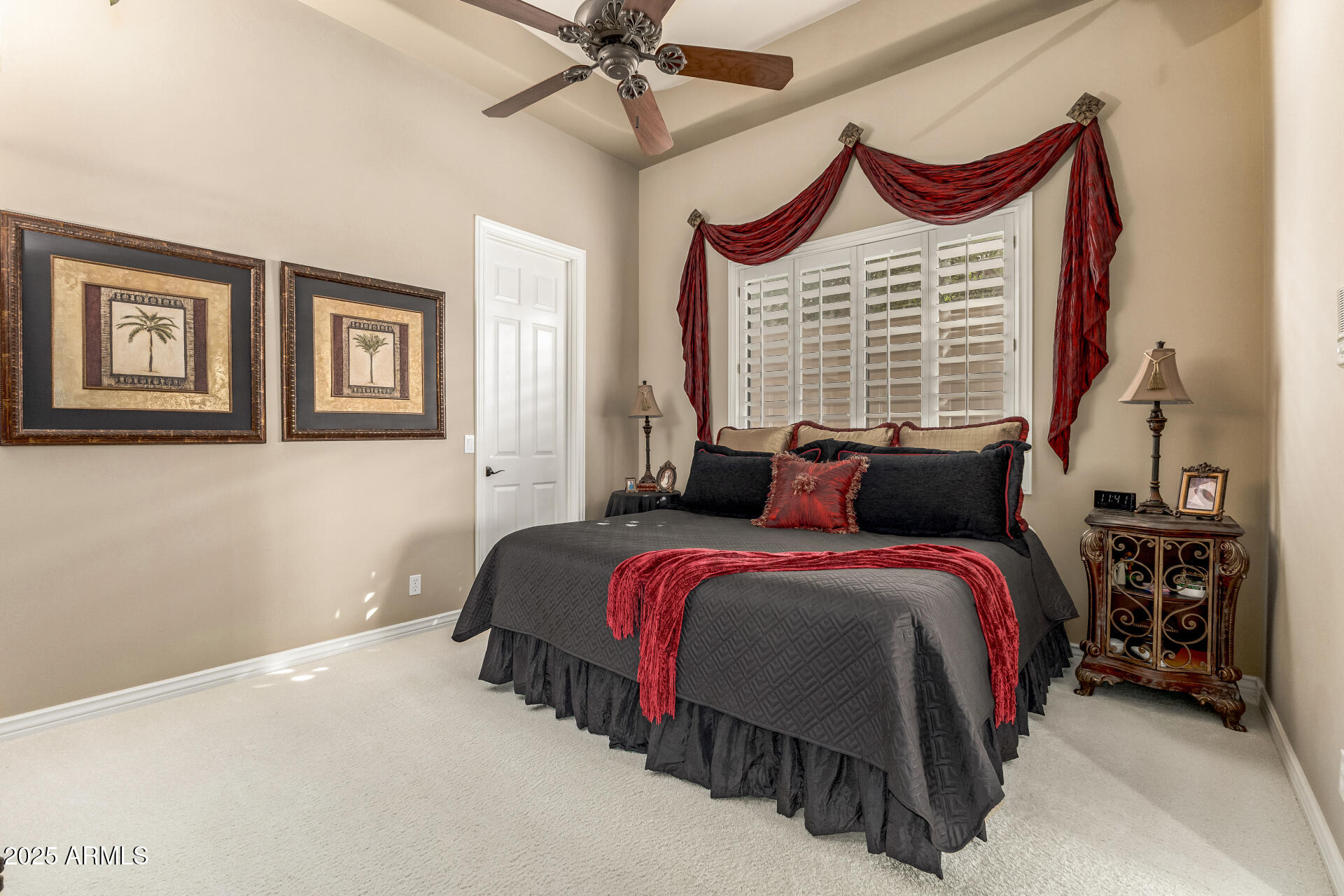 4055 North Recker Road Mesa, AZ 85215 - Photo 29 of 70 a bedroom with bed and a chandelier