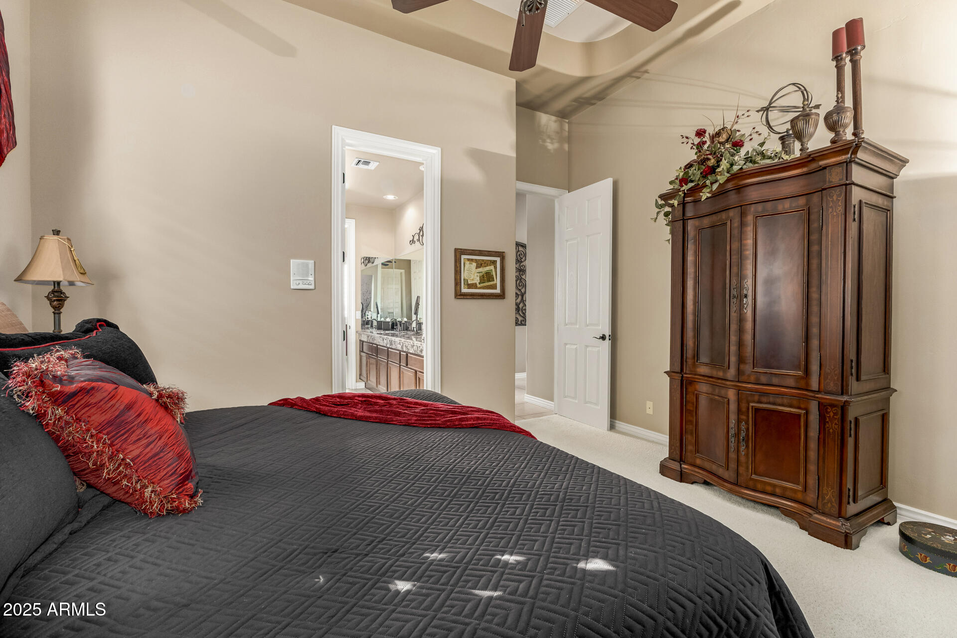 4055 North Recker Road Mesa, AZ 85215 - Photo 30 of 70 a bedroom with a bed and wooden floor