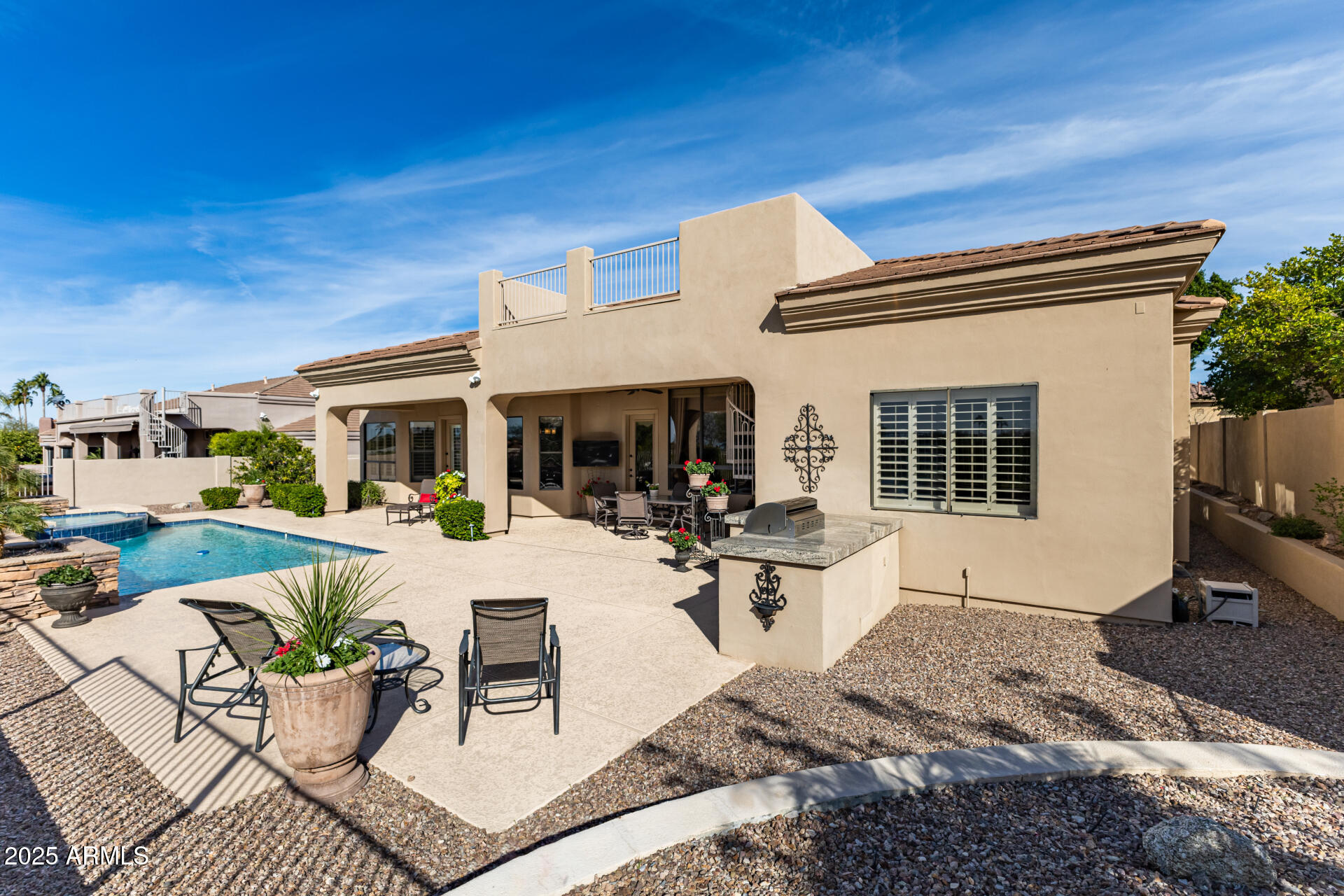 4055 North Recker Road Mesa, AZ 85215 - Photo 41 of 70 a view of a patio with couches table and chairs and potted plants