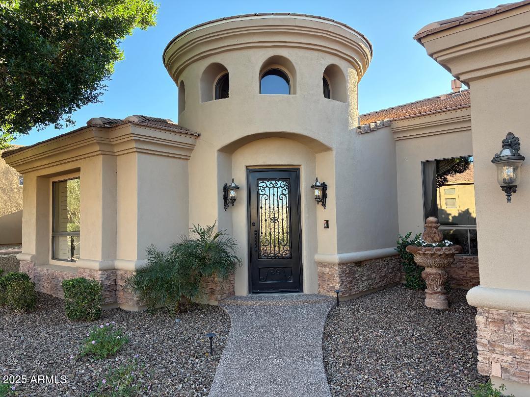4055 North Recker Road Mesa, AZ 85215 - Photo 4 of 70 a view of a house with large windows and plants