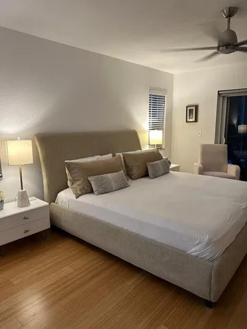 a bedroom with bed and window