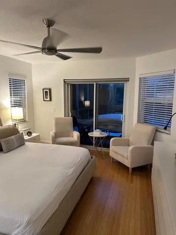 a bedroom with bed and a couch