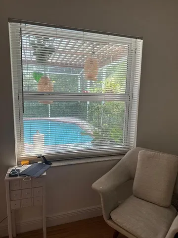 a living room filled with furniture and a window