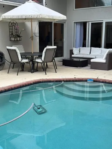 a view of house with outdoor seating space