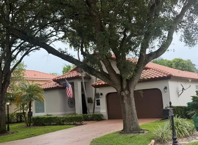 a front view of a house with garden
