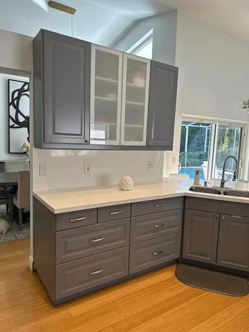 a kitchen with stainless steel appliances granite countertop a sink and cabinets