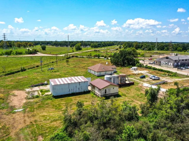 a view of a backyard with swimming pool and lake view