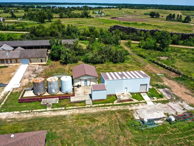 a aerial view of a residential apartment building with a yard