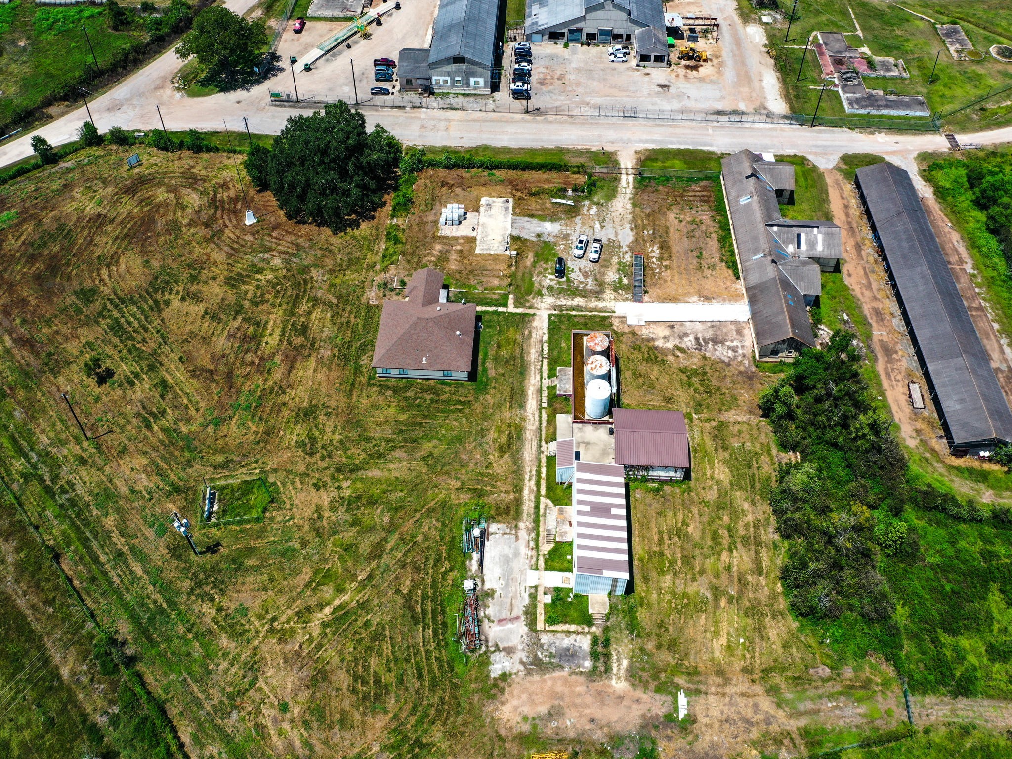 303 Vat Road Boling, TX 77420 - Photo 26 of 31 a aerial view of a residential apartment building with a yard