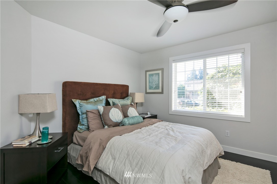 1511 232nd Place Southwest Bothell, WA 98021 - Photo 14 of 25 a bedroom with a bed and a night stand