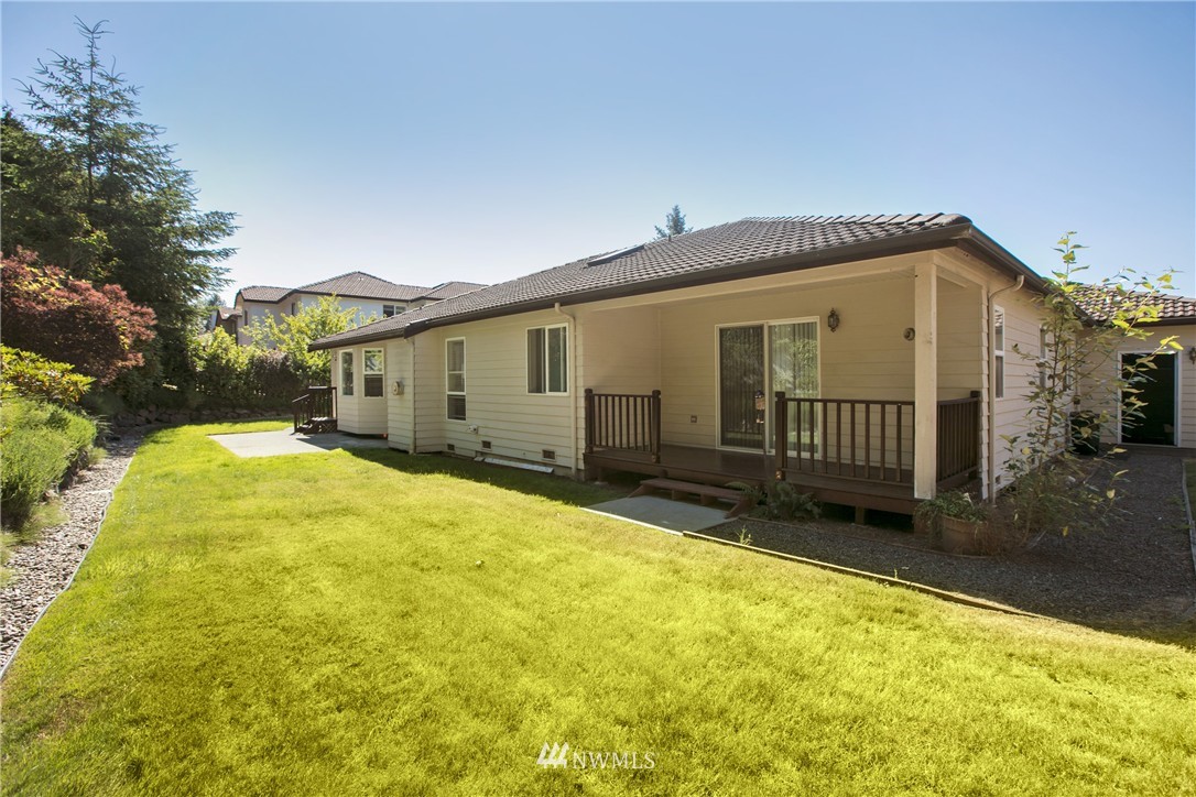 1511 232nd Place Southwest Bothell, WA 98021 - Photo 22 of 25 a view of a house with a yard