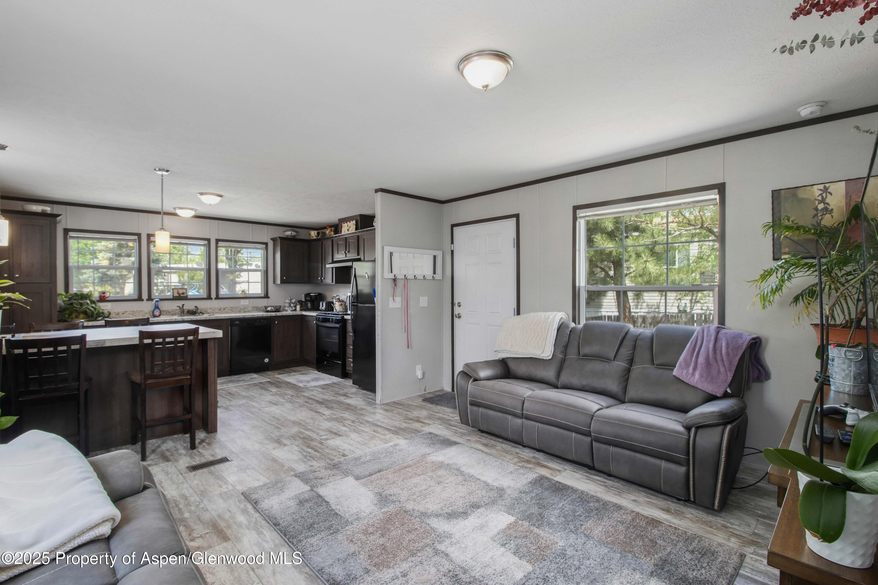88 West Carson Circle Parachute, CO 81635 - Photo 7 of 18 a living room with furniture and a large window