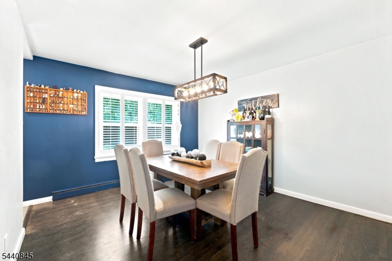 36 Forest Road Andover, NJ 07821 - Photo 33 of 50 a dining room with furniture a chandelier and wooden floor
