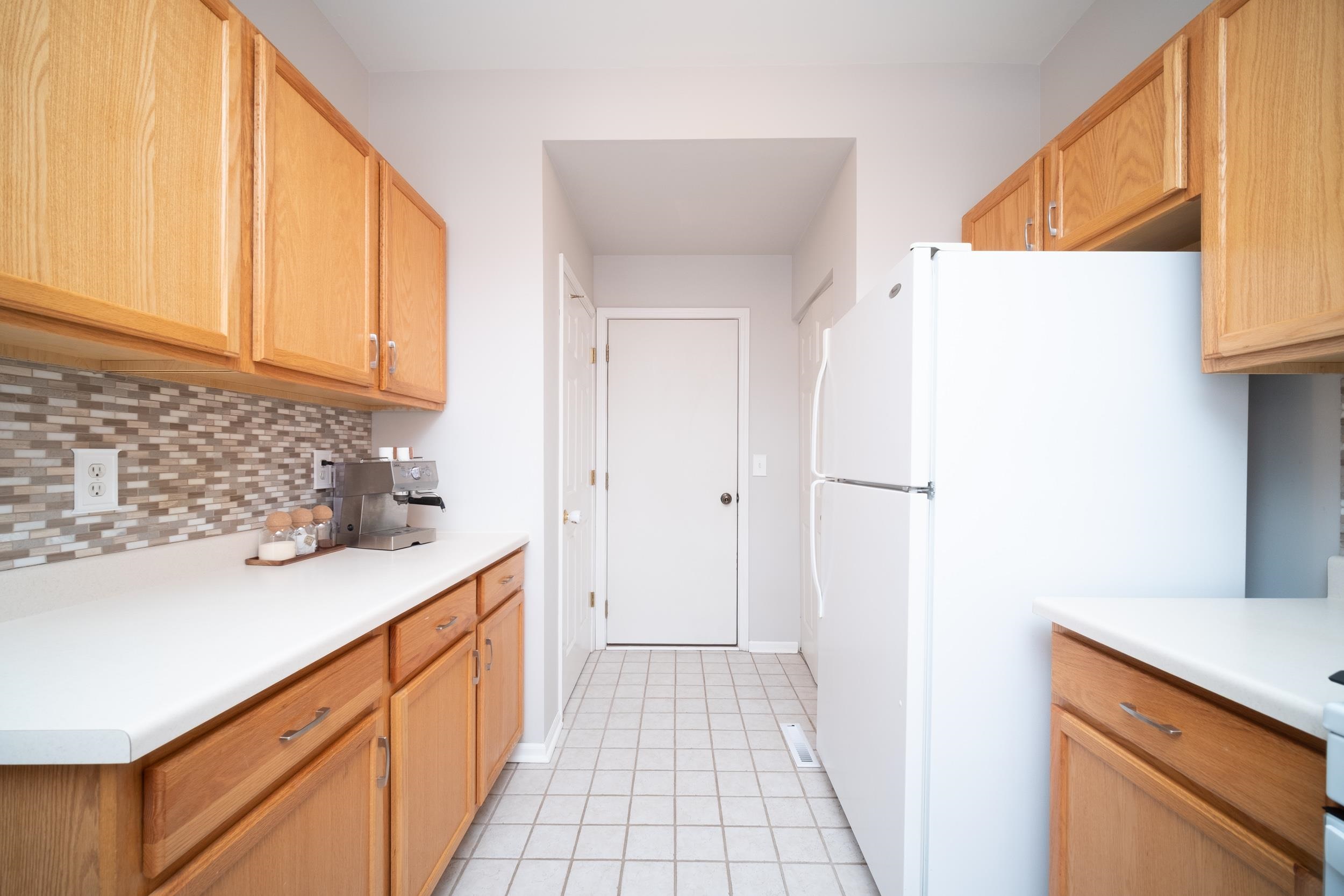 7253 Chucks Way Loves Park, IL 61111 - Photo 11 of 26 a kitchen with a sink and a refrigerator