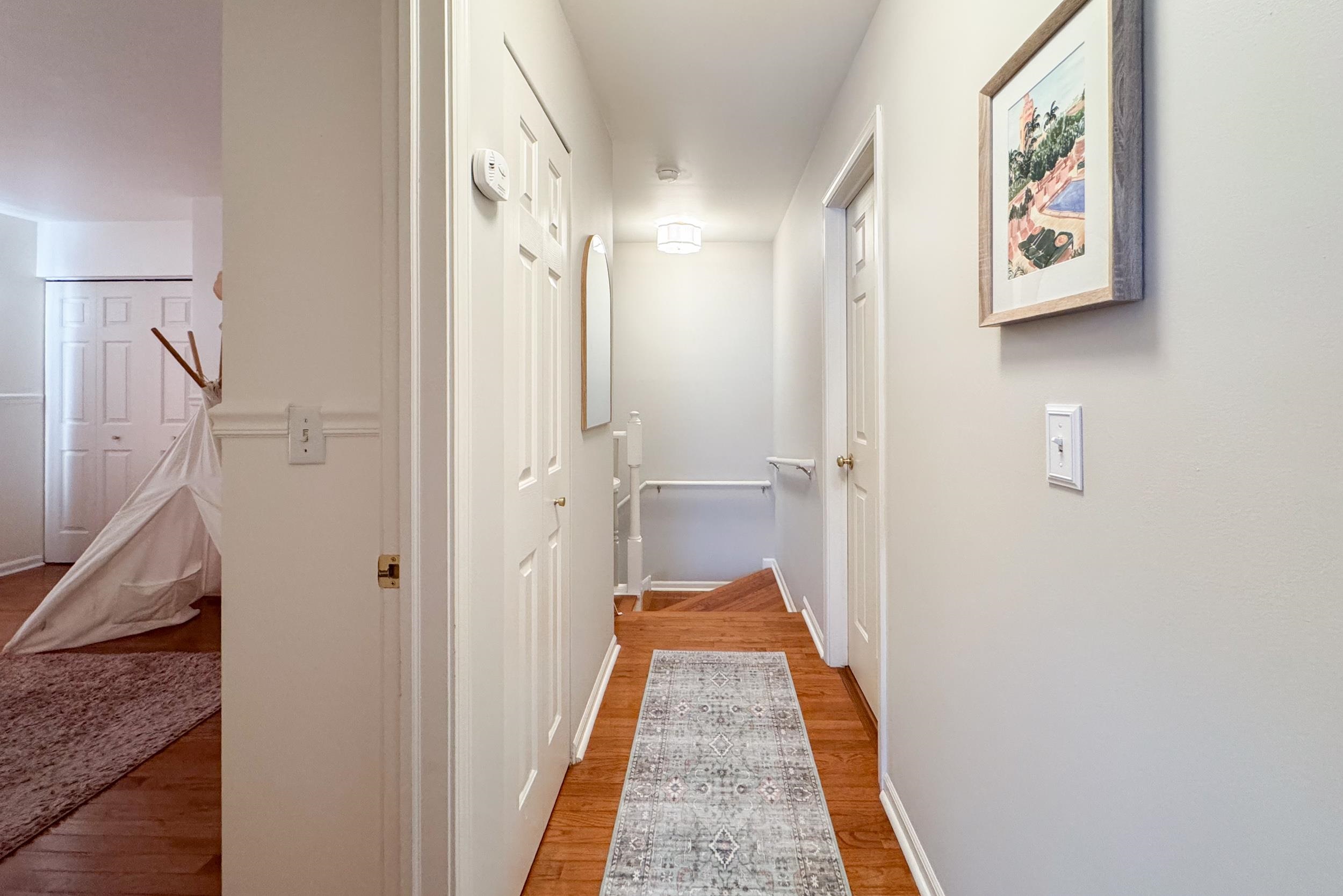 7253 Chucks Way Loves Park, IL 61111 - Photo 15 of 26 a view of a hallway with paintings on the wall