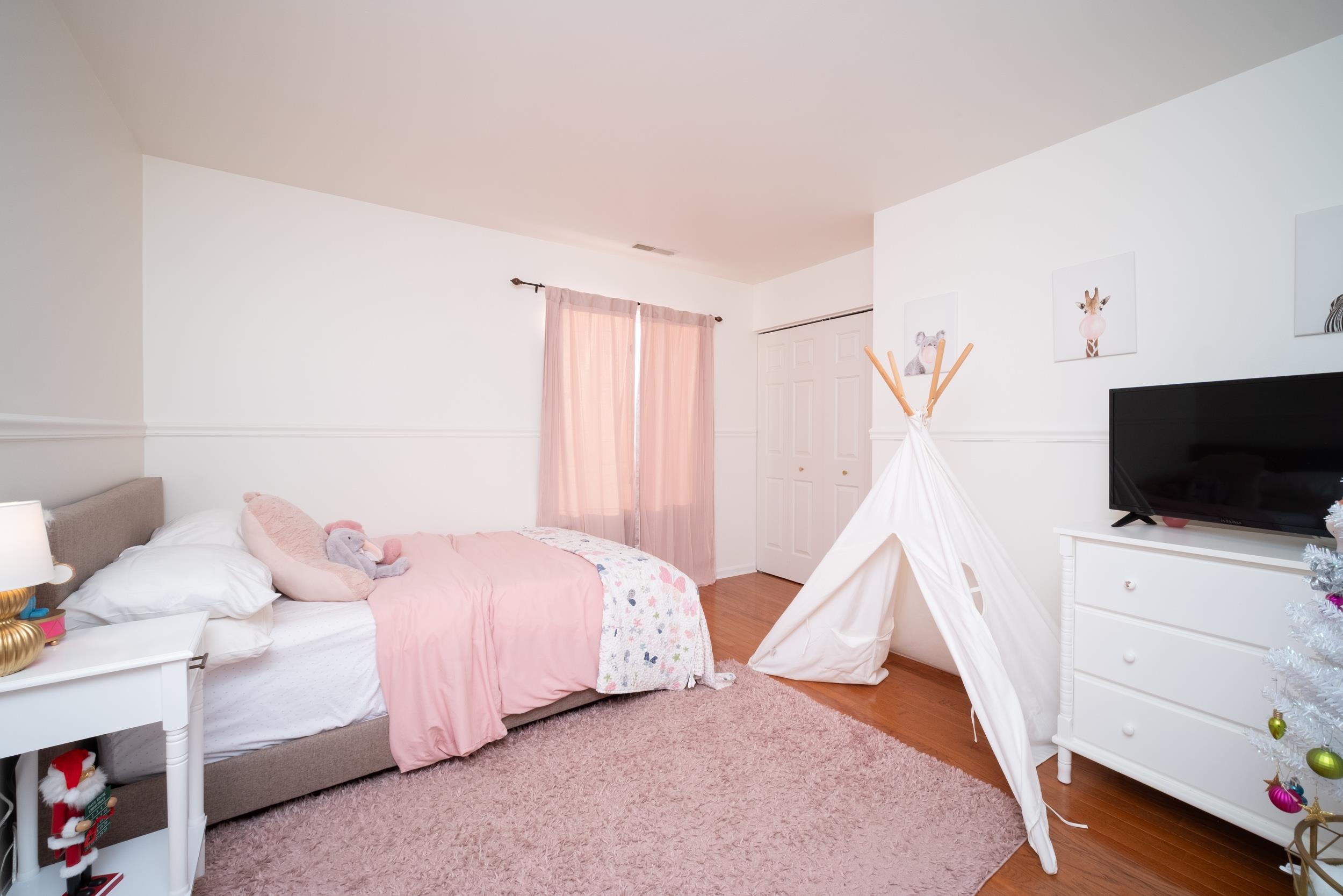 7253 Chucks Way Loves Park, IL 61111 - Photo 18 of 26 a bedroom with a bed and a flat screen tv