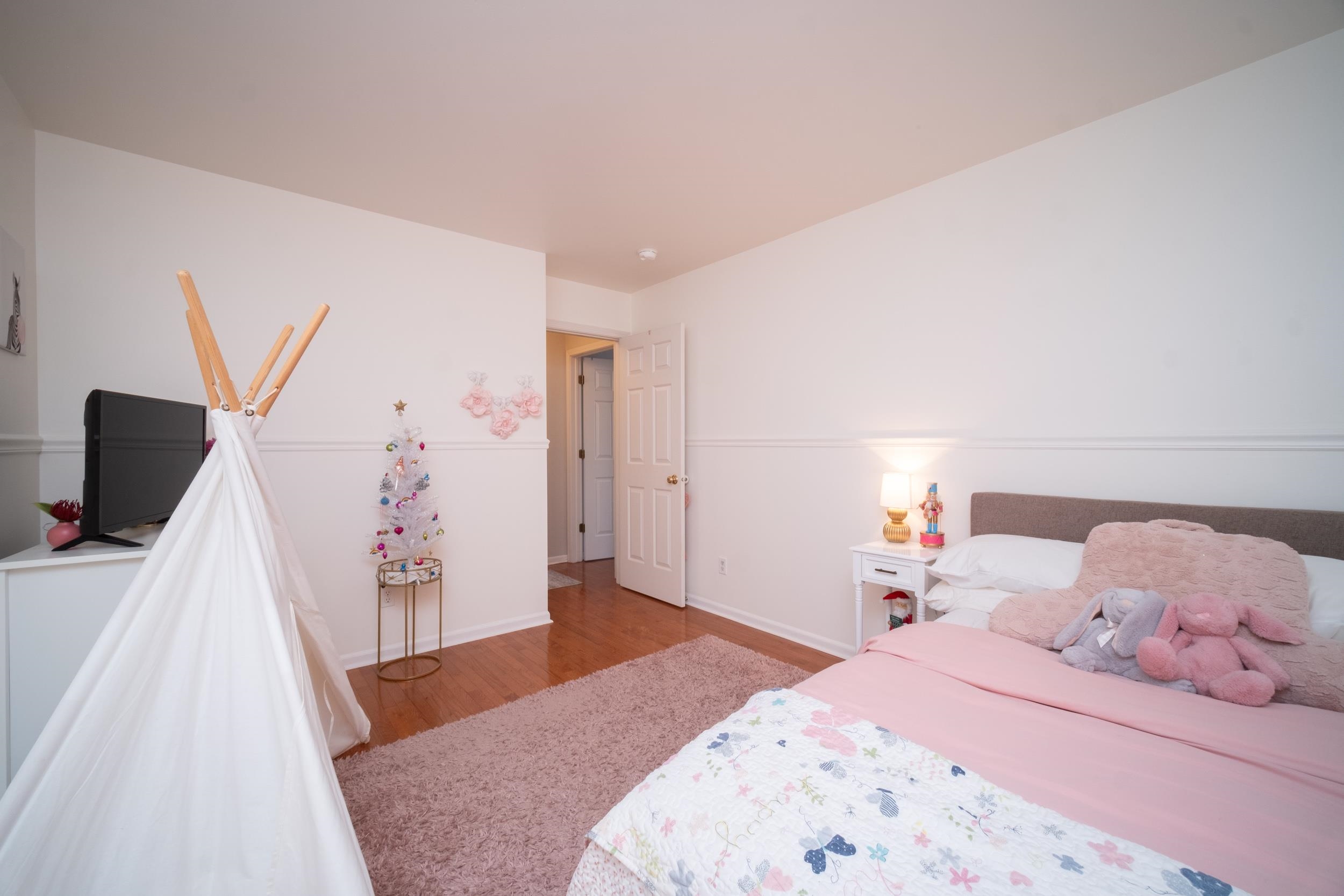 7253 Chucks Way Loves Park, IL 61111 - Photo 19 of 26 a bedroom with a bed and a flat screen tv