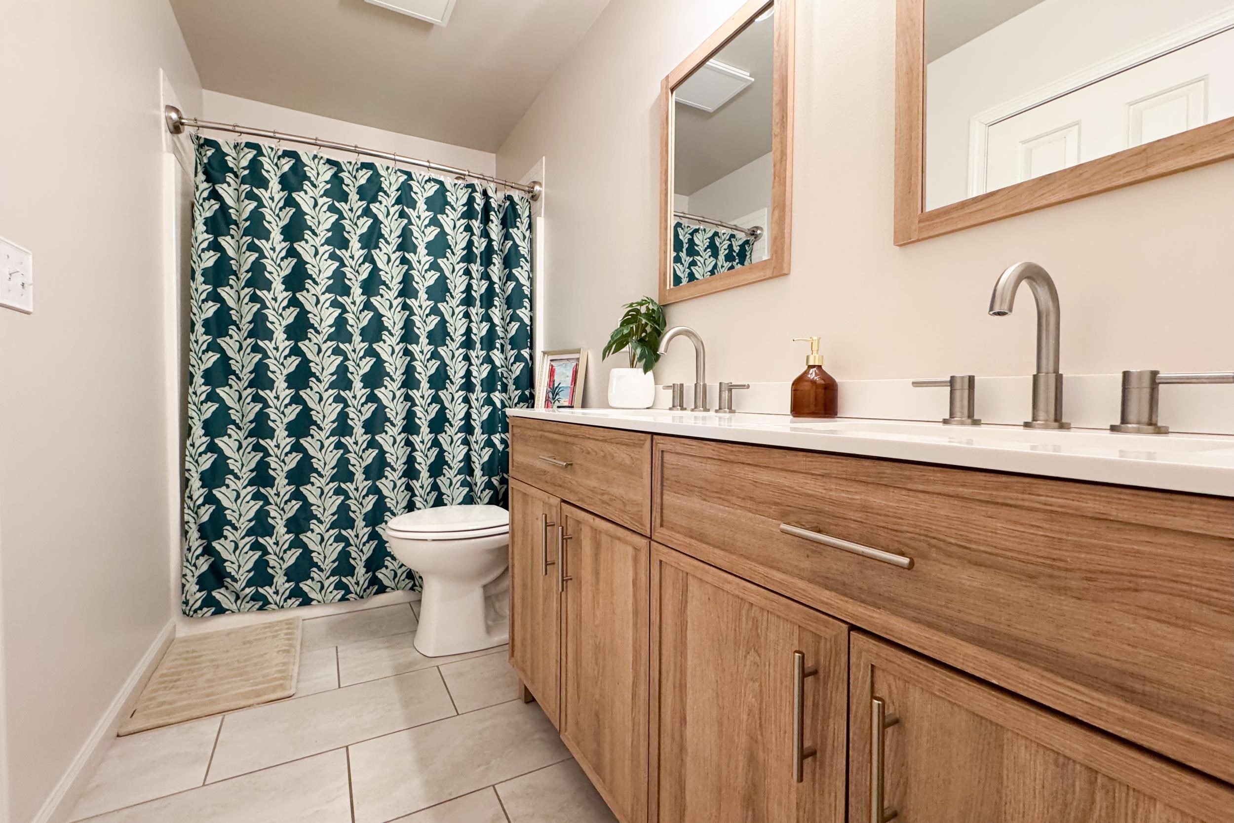 7253 Chucks Way Loves Park, IL 61111 - Photo 20 of 26 a bathroom with a sink a toilet and a mirror