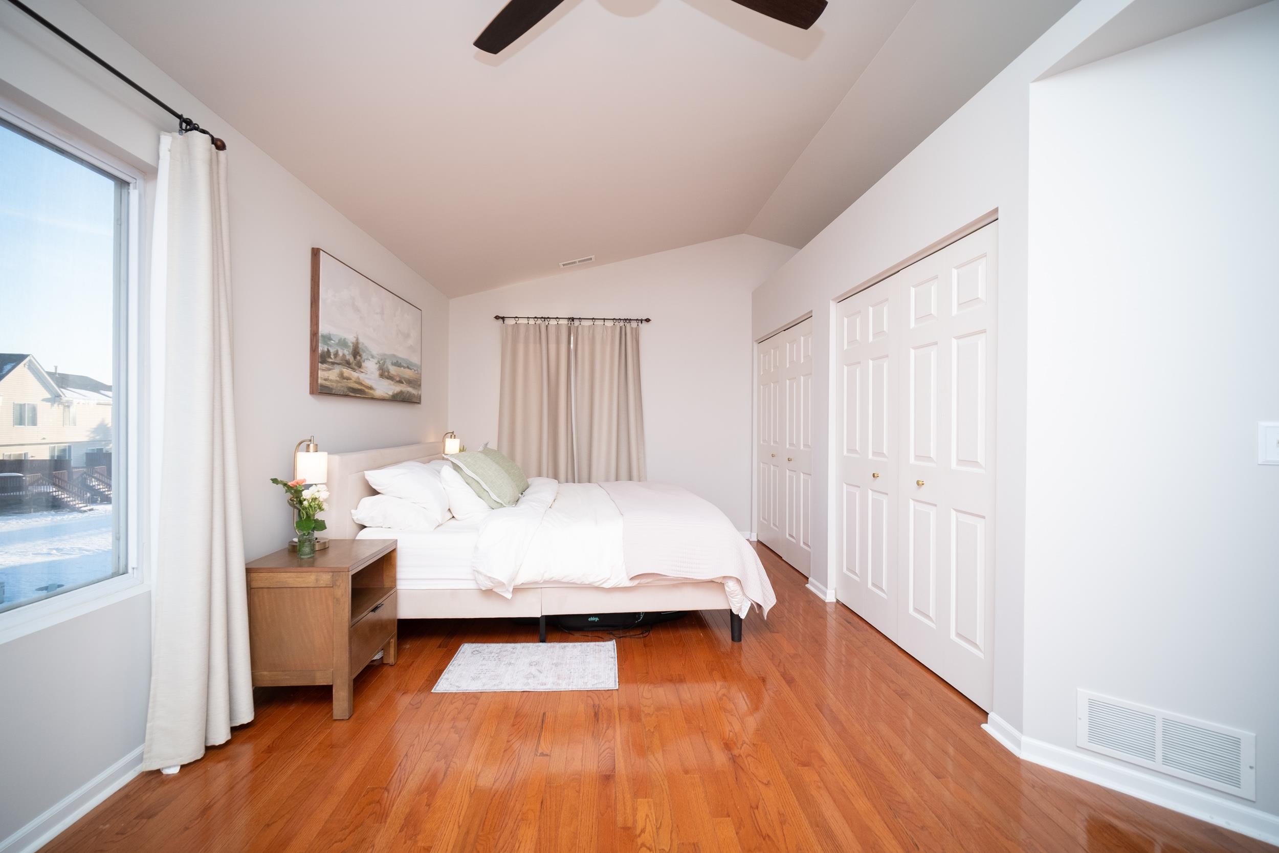 7253 Chucks Way Loves Park, IL 61111 - Photo 22 of 26 a bedroom with a bed and wooden floor