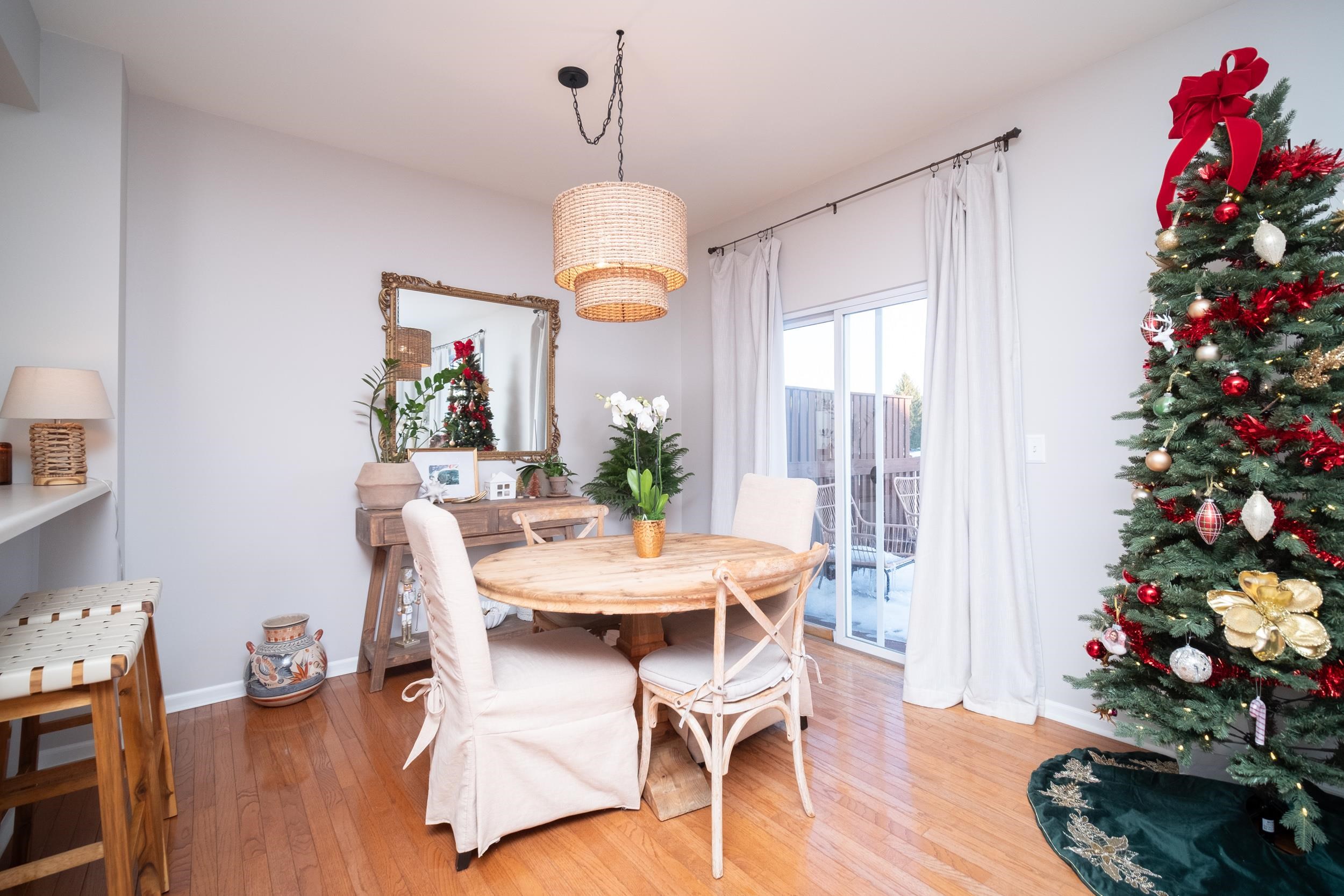 7253 Chucks Way Loves Park, IL 61111 - Photo 8 of 26 a view of a dining room with furniture wooden floor and chandelier