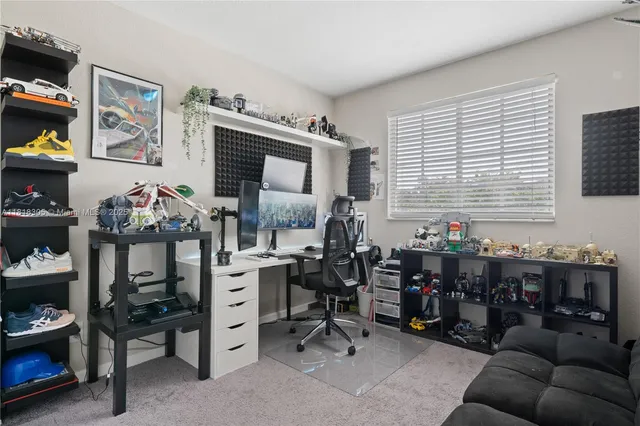 a view of a workspace with lots of furniture and toys