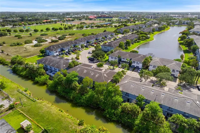 an aerial view of residential houses with outdoor space