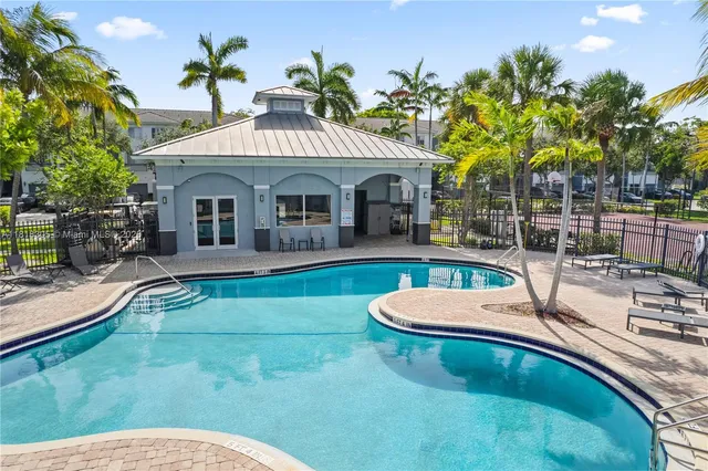 a front view of a house with swimming pool